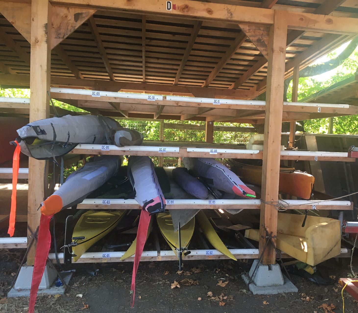 Small Outrigger Canoes in their storage locations.